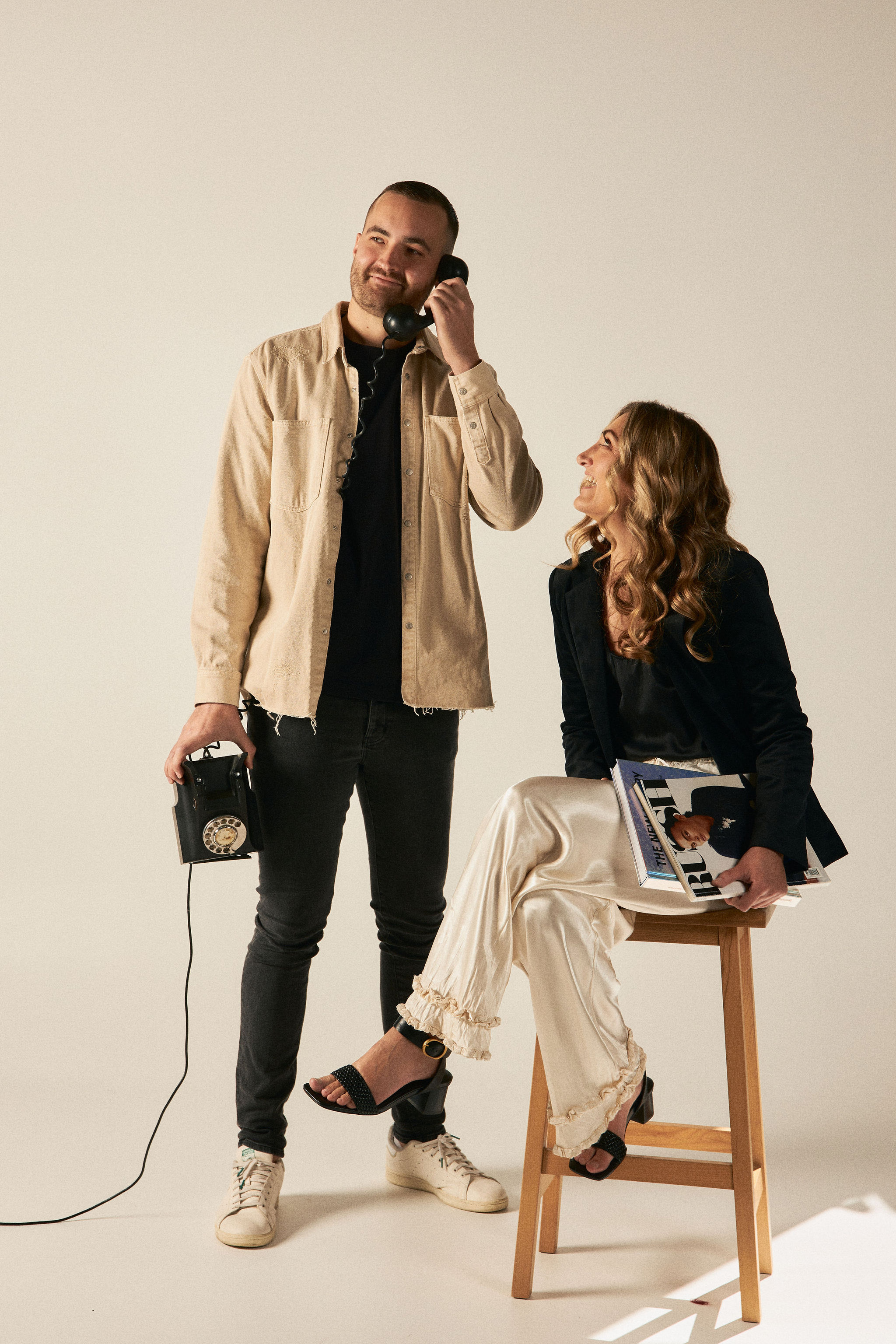 A team of two people boldly during a brand photography session.