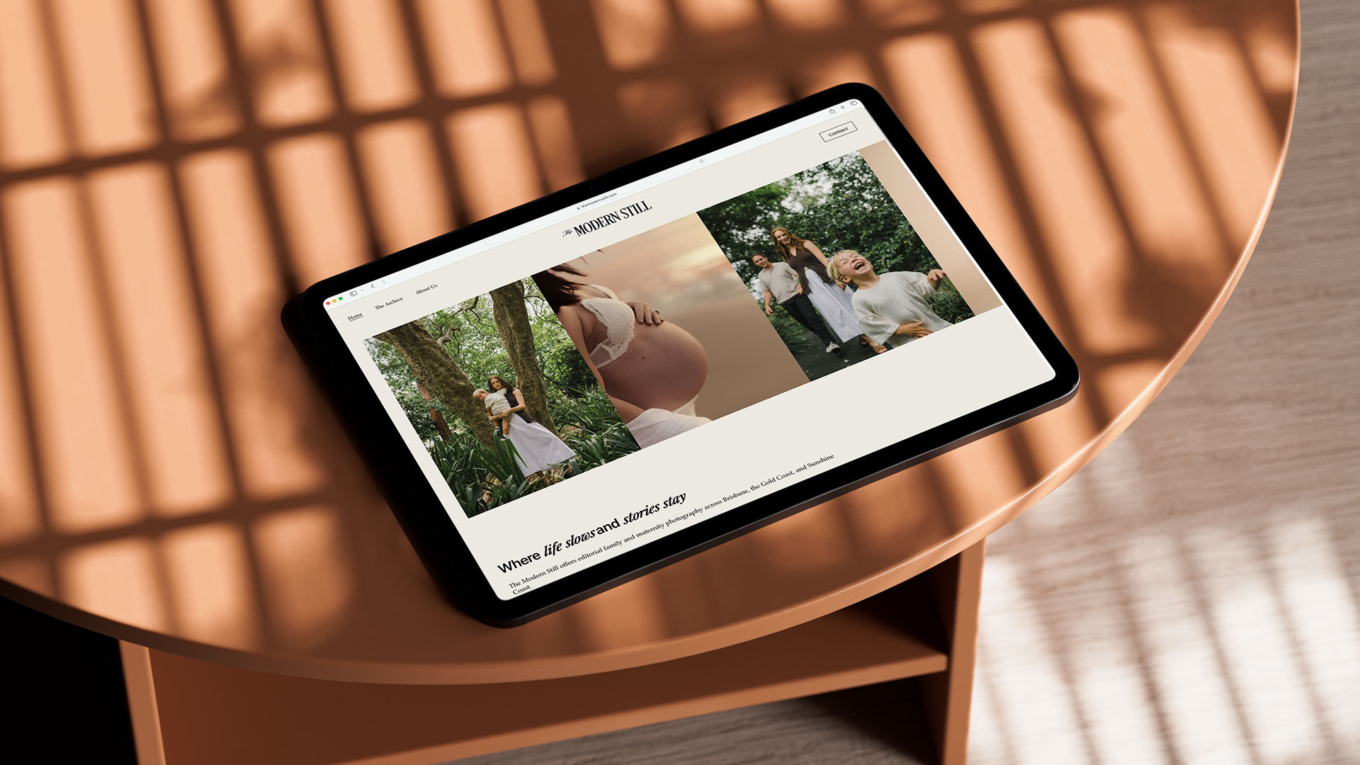 An image of an iPad showcasing The Modern Still Website.