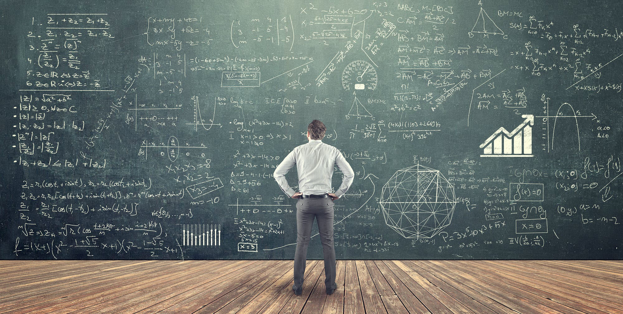 A business owner standing in front of a chalkboard covered in complex equations and graphs, illustrating the difficulty of manual inventory management.
