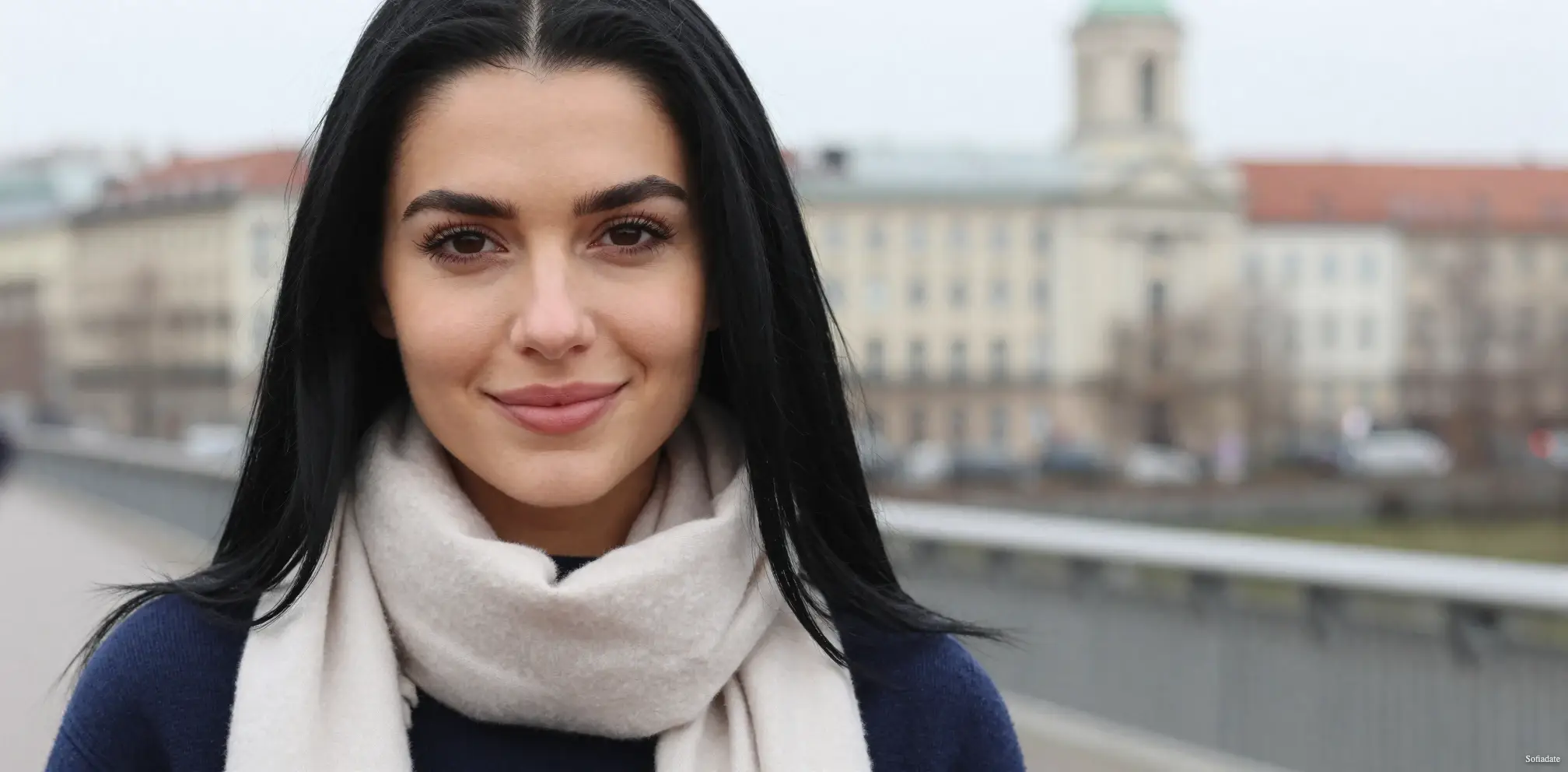 A beautiful girl is walking around the city