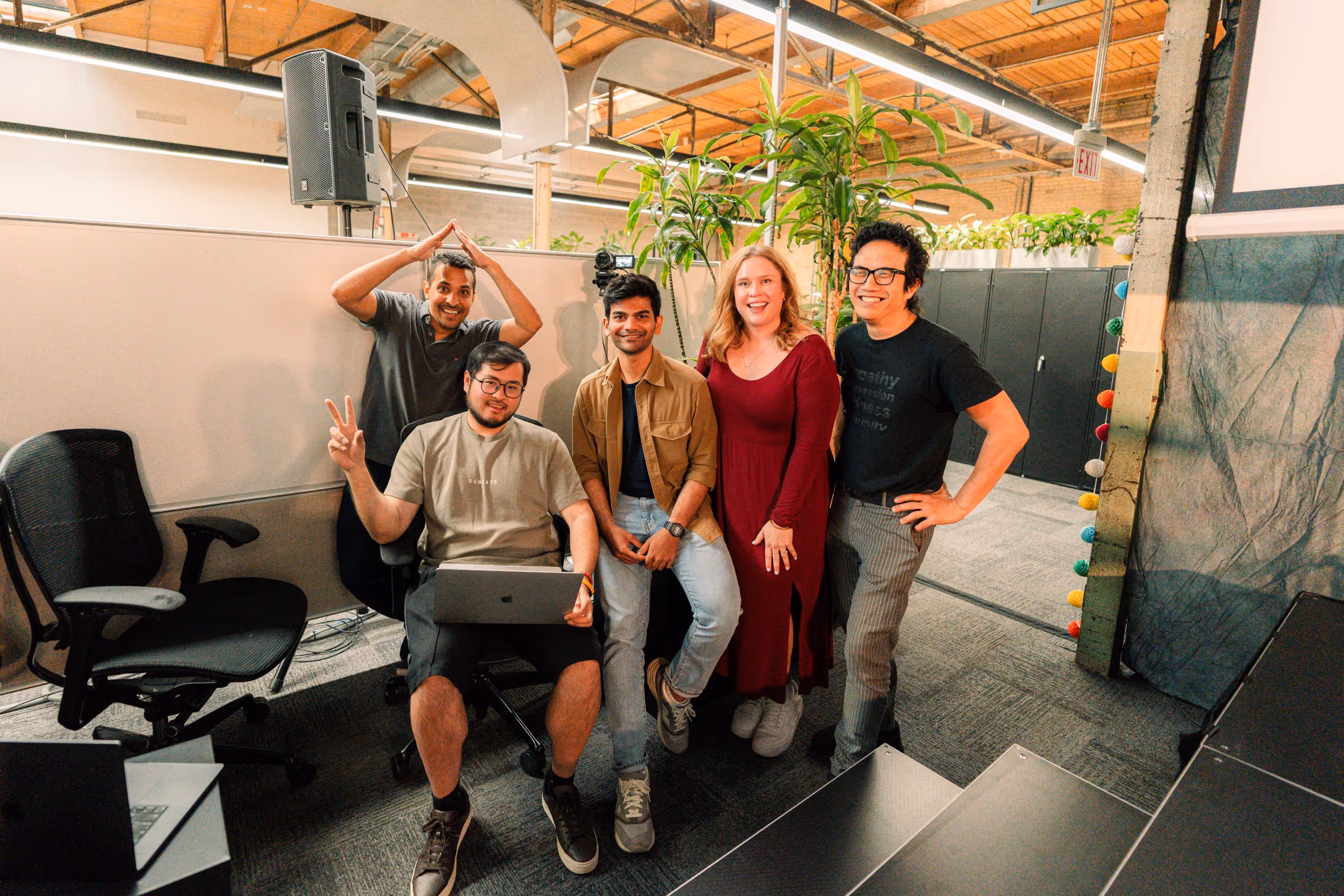 A group of Wavelo employees at an event for AI initiatives.