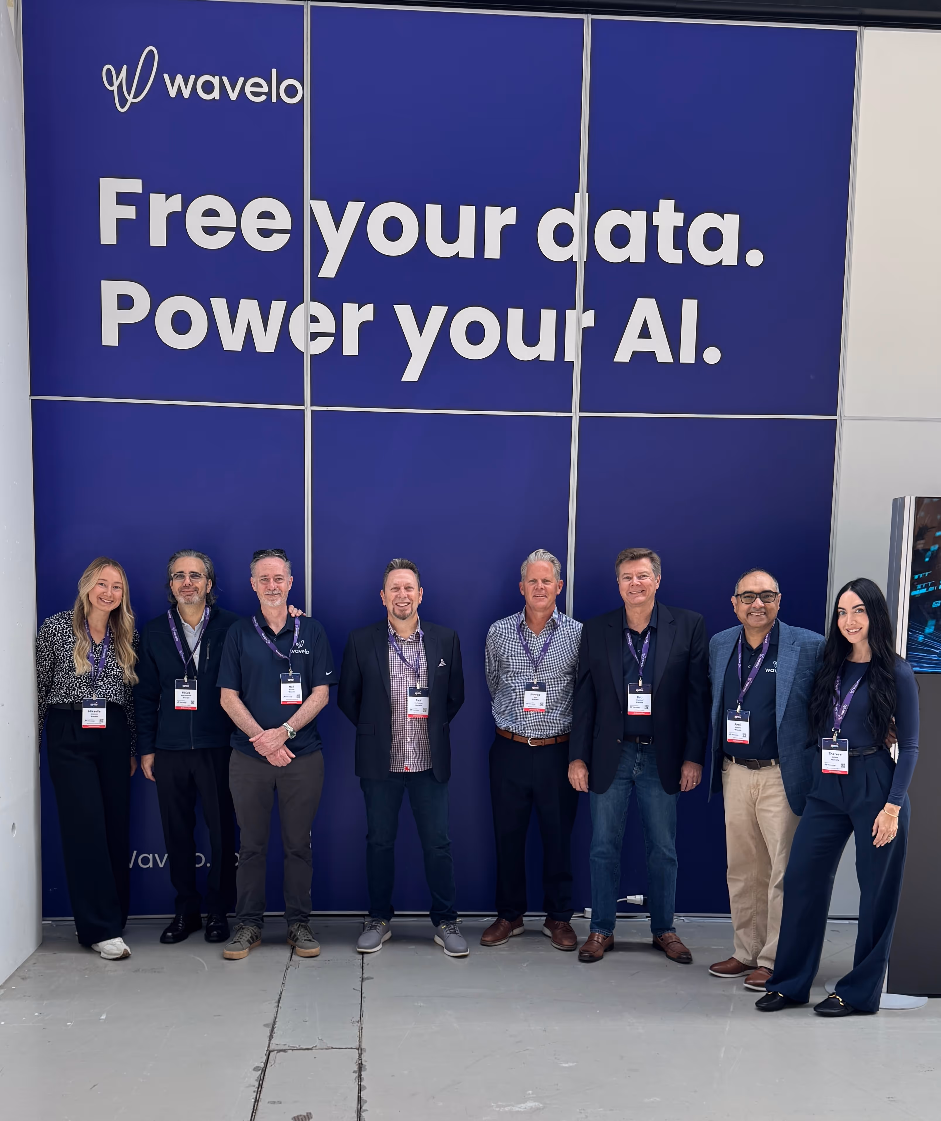 A group of Wavelo employees at a conference