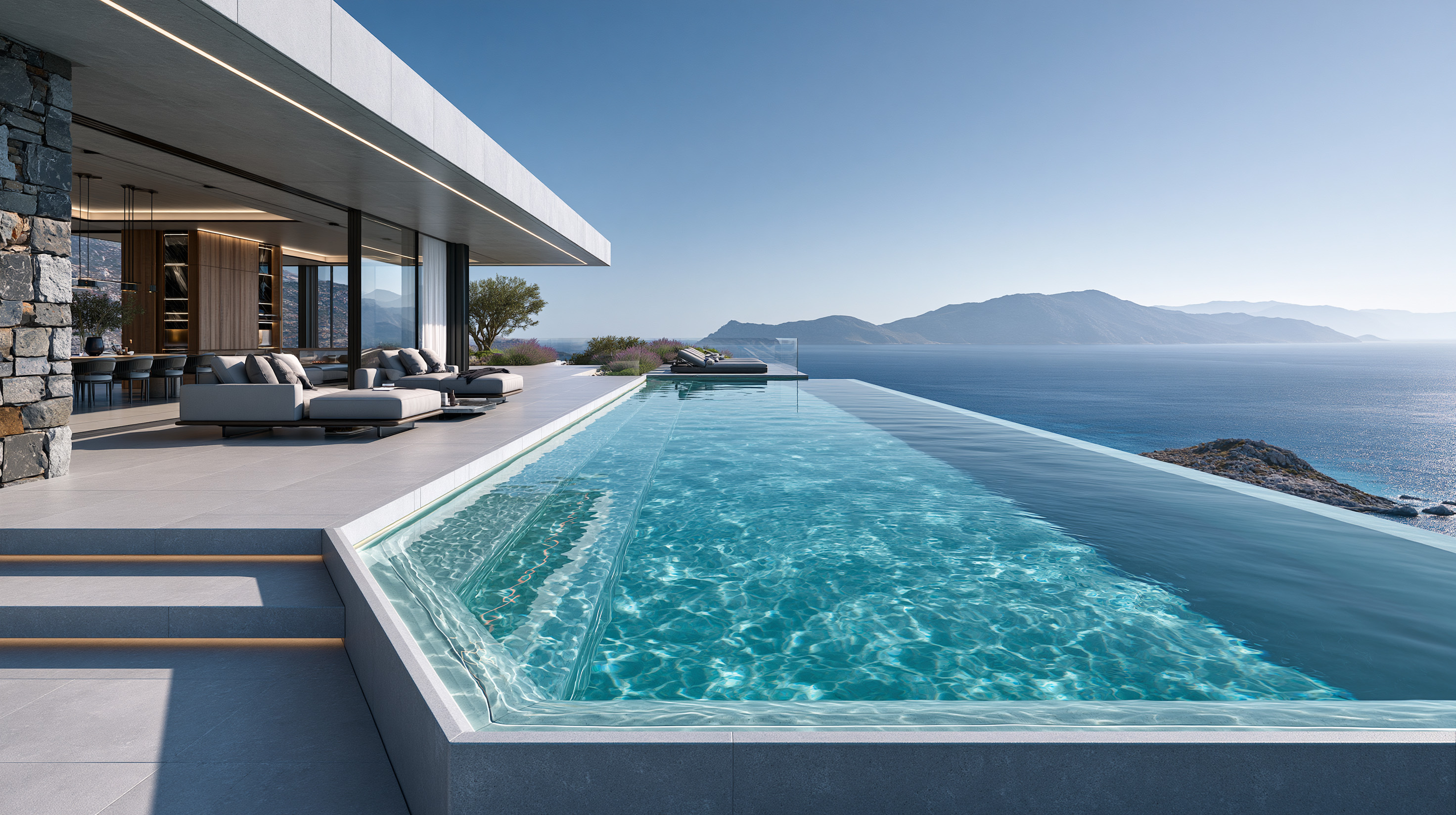 Infinity pool at a modern villa in Spain overlooking the sea and mountains