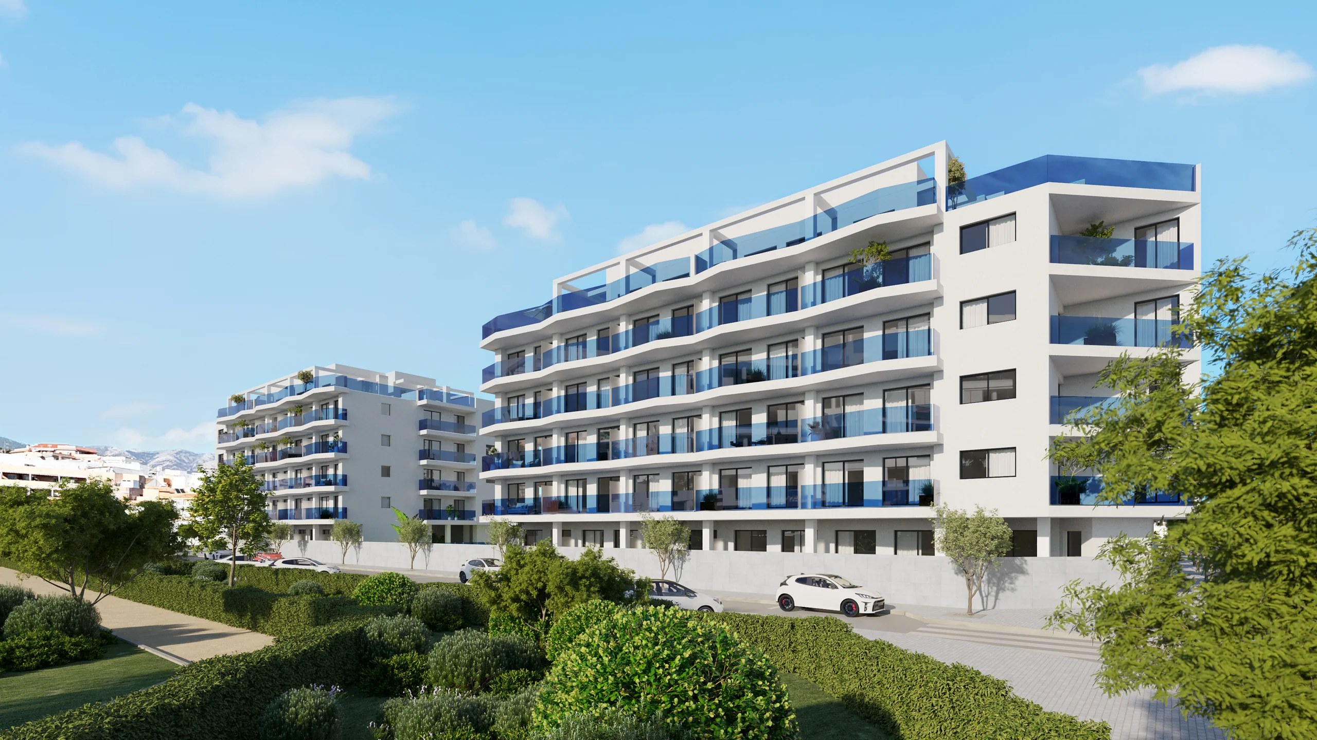 Rendering of a modern apartment building with tiered blue-glass balconies and a rooftop terrace, seen from the street with parked cars and hills in the distance – Laguna One, a 1-bedroom apartment in Las Lagunas, Mijas, Málaga, Costa del Sol
