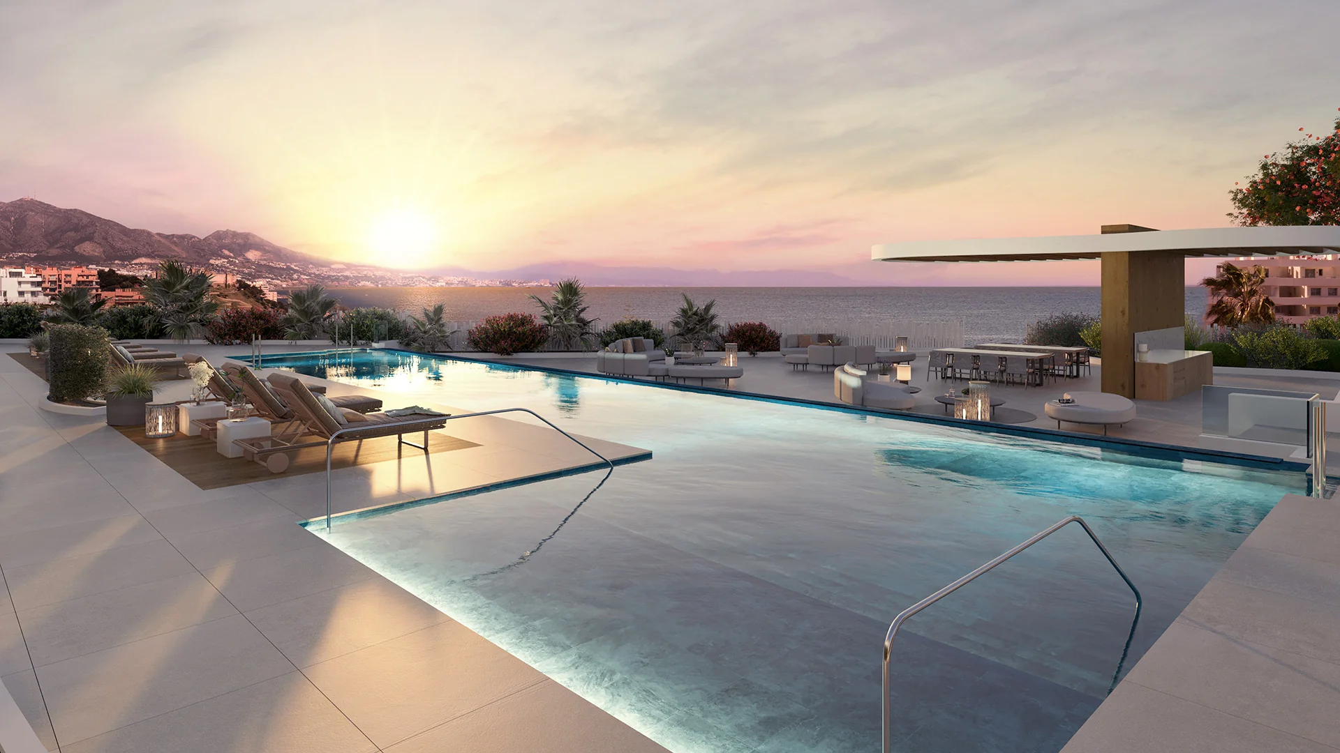 Rendering of a rooftop infinity pool with lounge chairs and an outdoor bar pergola overlooking the sea and coastal mountains at sunset – Elysea Suites, a 2-bedroom apartment in Mijas Costa, Málaga