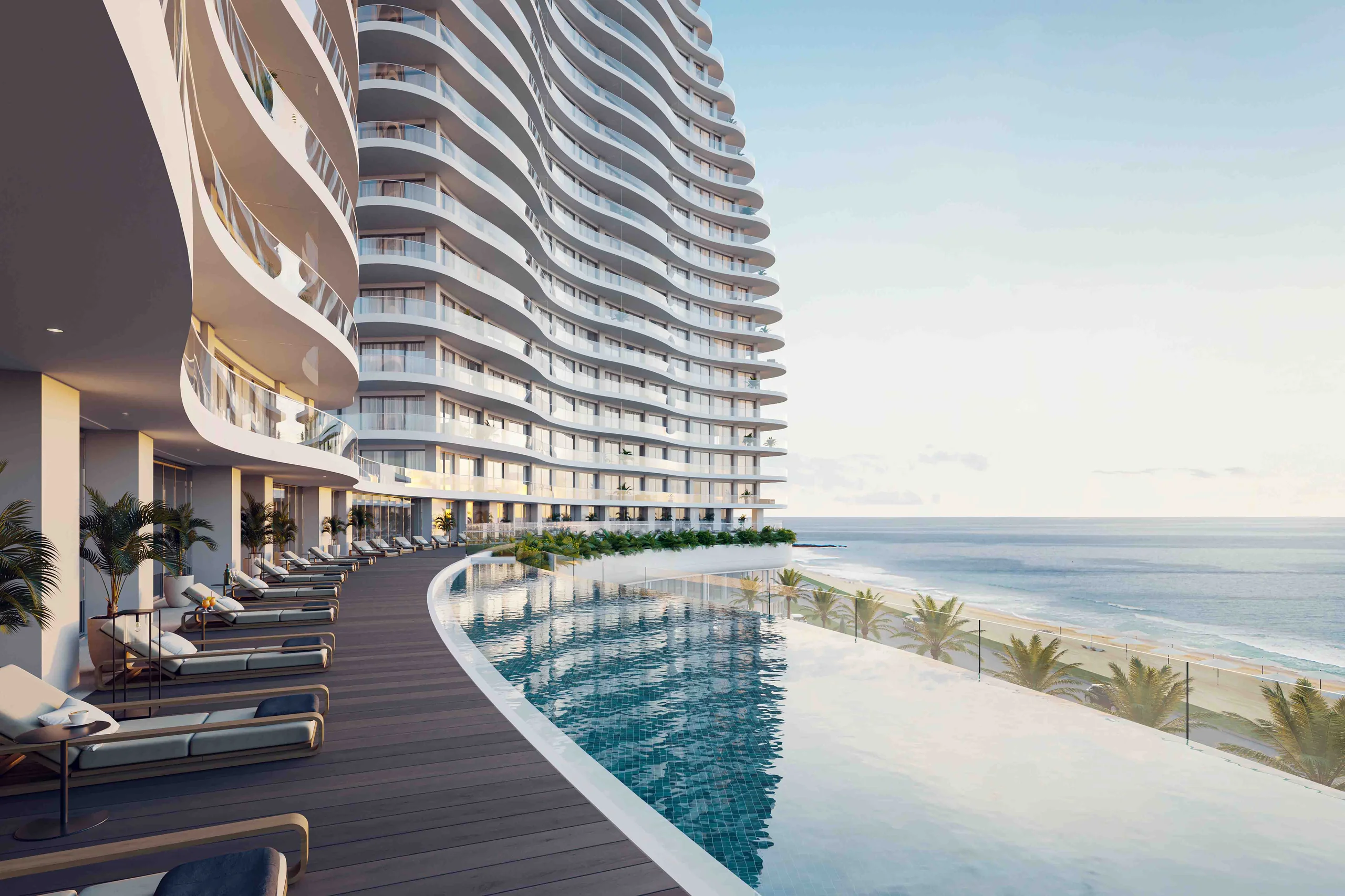 Curved high-rise tower with an infinity pool along a wooden sundeck overlooking the beach and sea – Limassol Del Mar, a 4-bedroom penthouse in Limassol Del Mar, Limassol, Cyprus