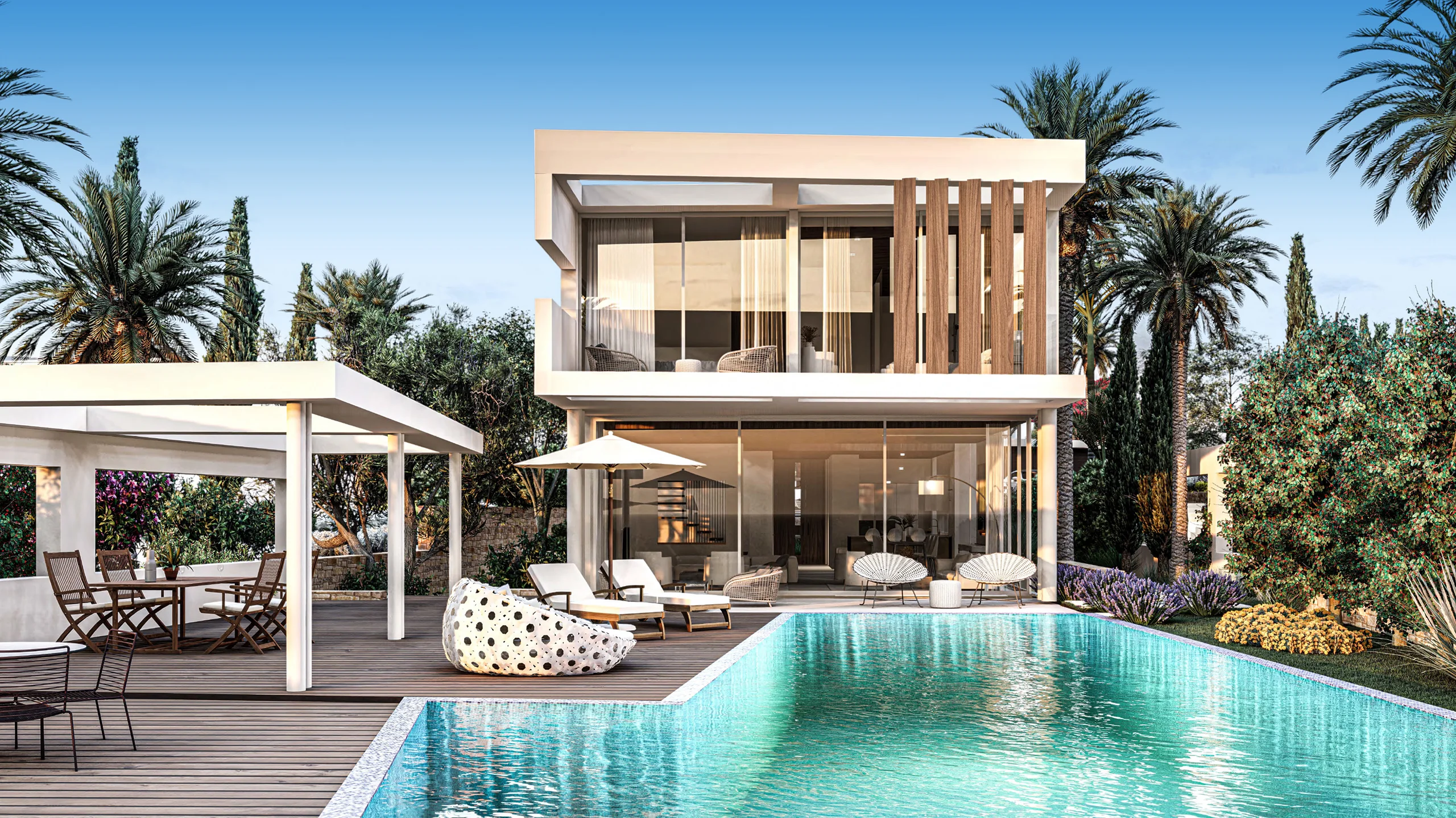 Modern two-story villa with timber slat screening and a pergola dining terrace beside a free-form pool bordered by palms and flowering shrubs – Maniki Beach Villas, a 5-bedroom villa in Pegeia, Paphos, Cyprus