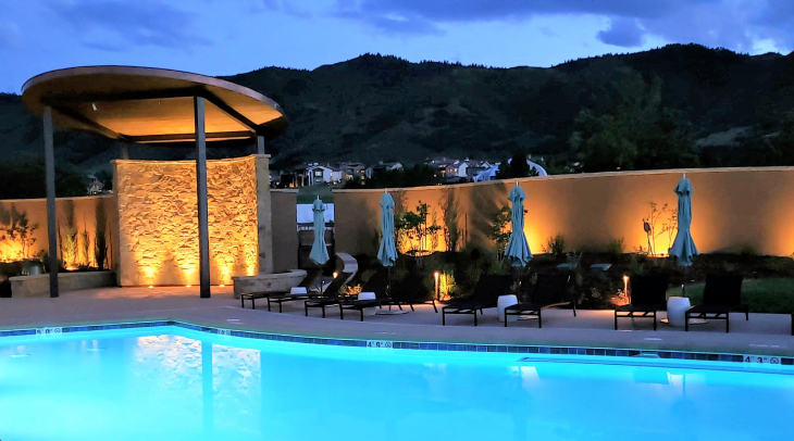 Outdoor patio lighting at Ravenna Golf Club with fire pit and Colorado mountain views