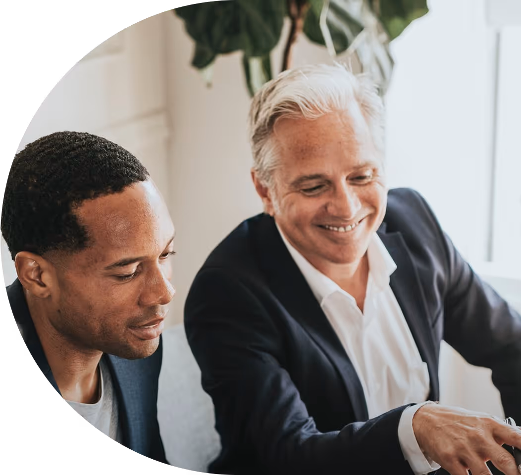 Two businessmen working together at a desk