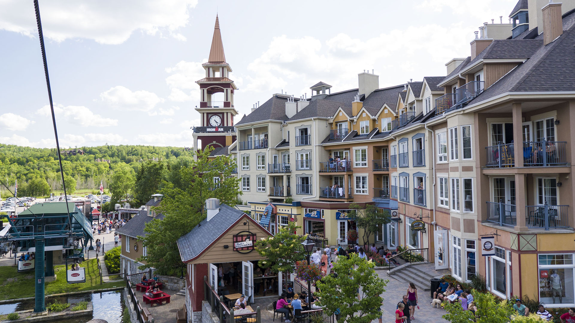 Mont Tremblant village with clock tower and colorful buildings.