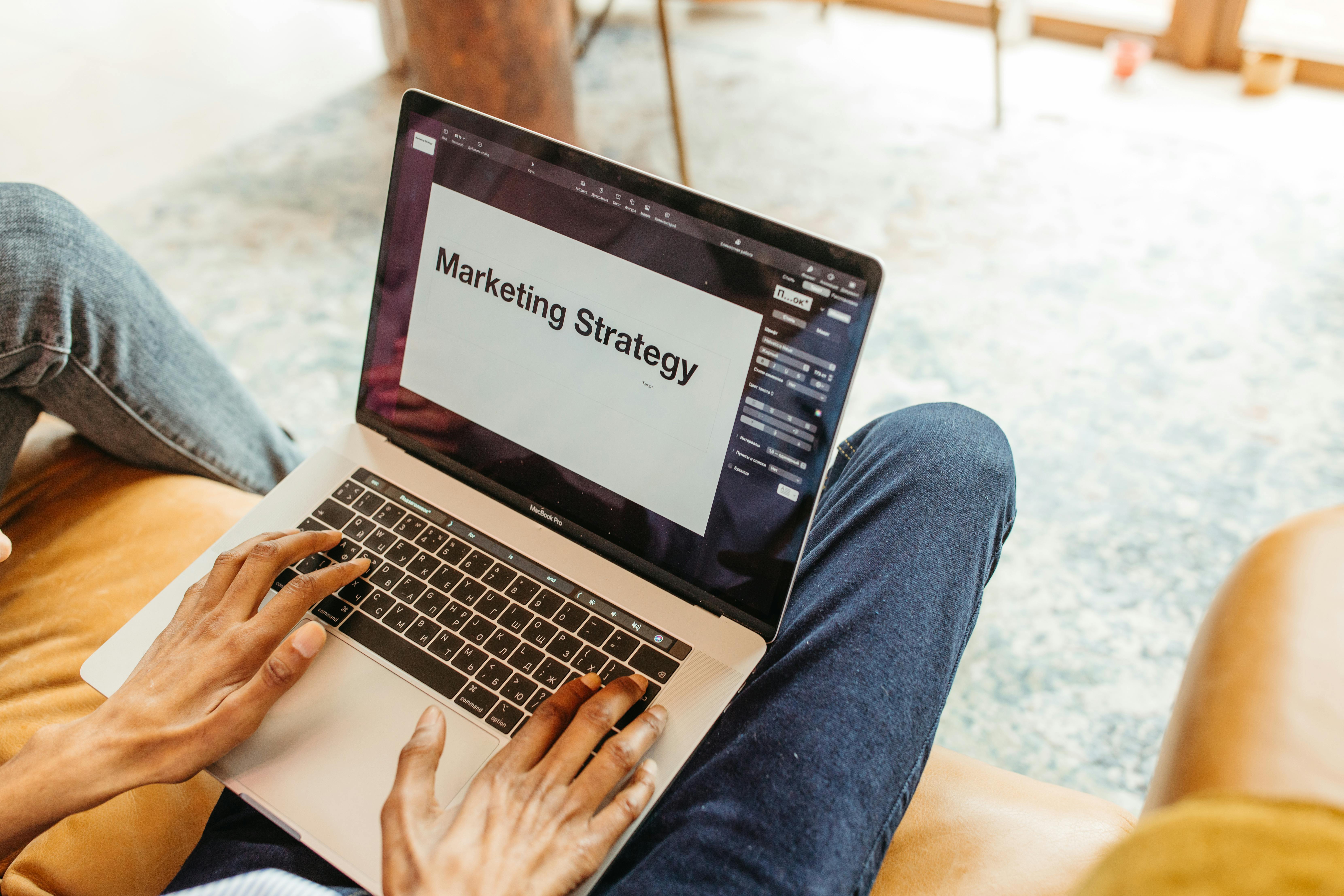 Laptop screen displaying a marketing strategy plan, focusing on increasing visibility and bookings for rentals.