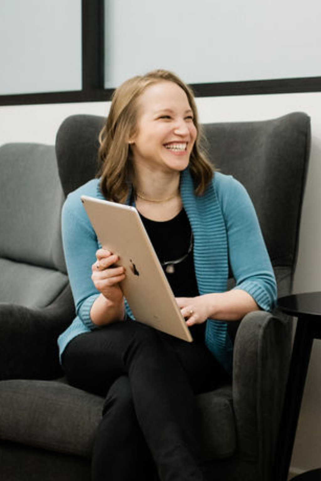 Photo of a smiling patient wearing headphones