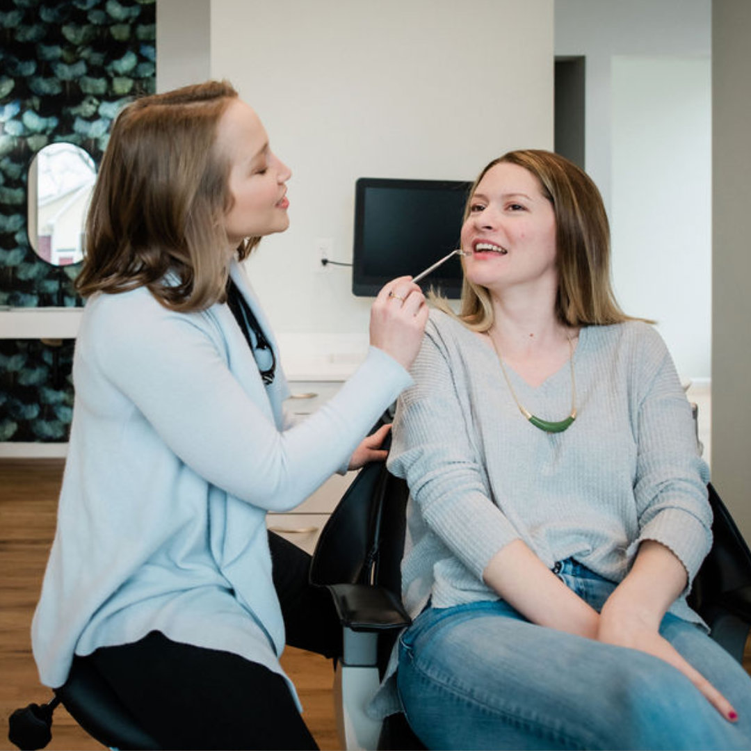 Photo of a smiling patient wearing headphones