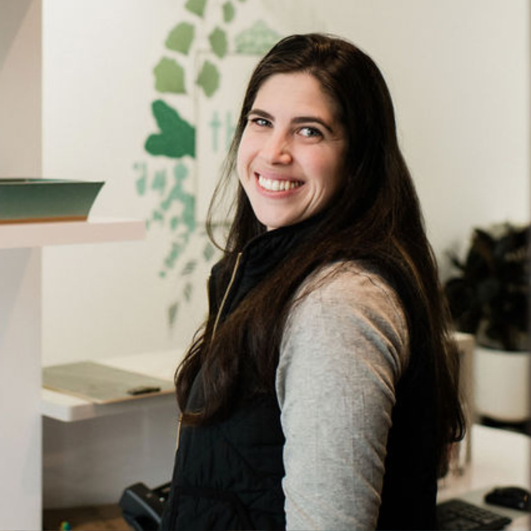 Photo of a smiling patient wearing headphones