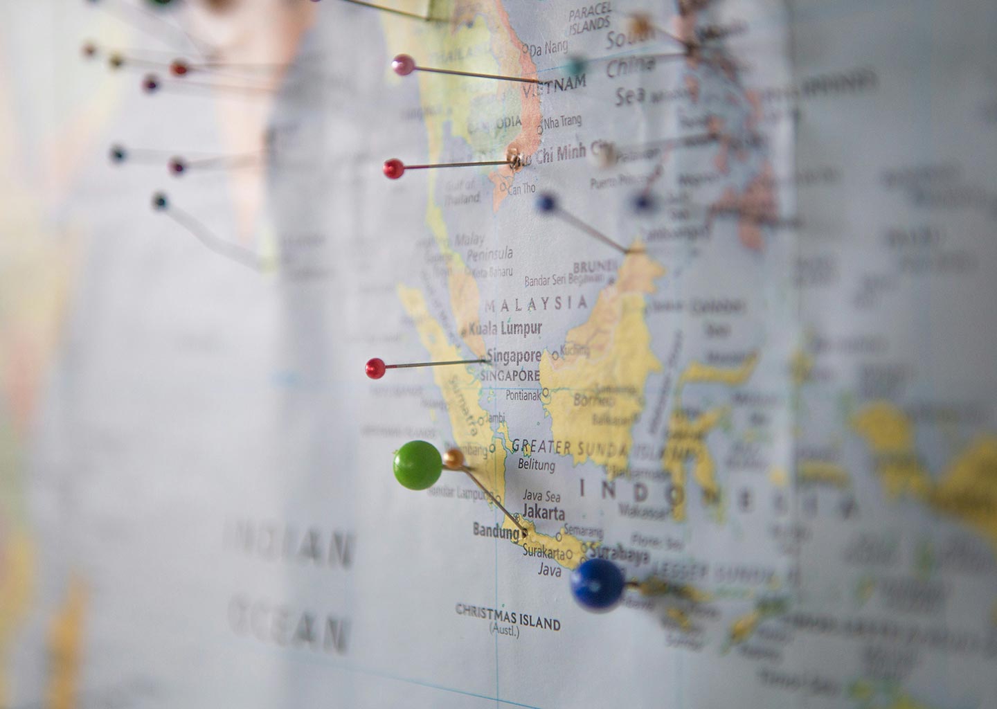 A world map with red pins on several locations.