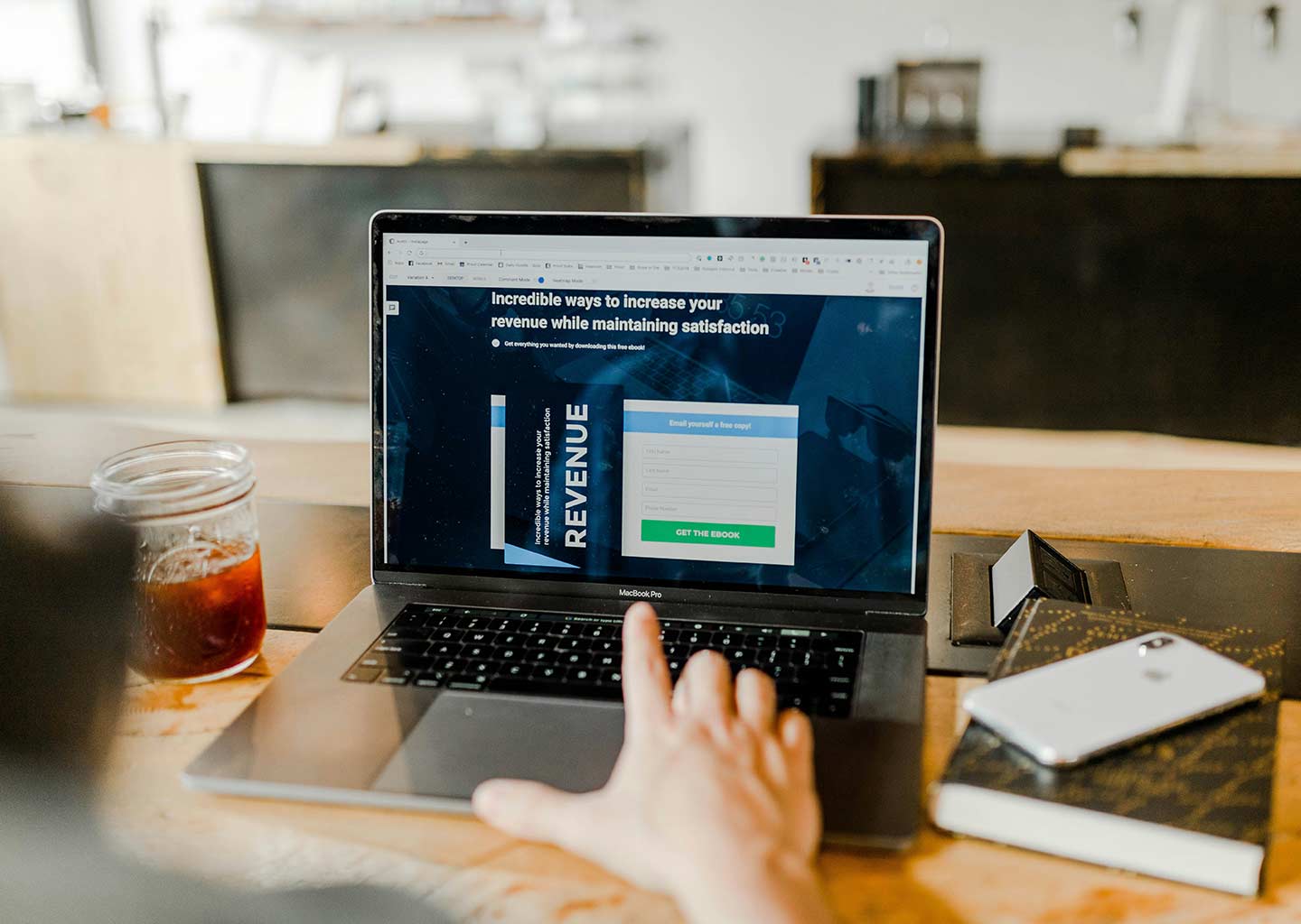 An online shop tracks it revenue on a laptop.