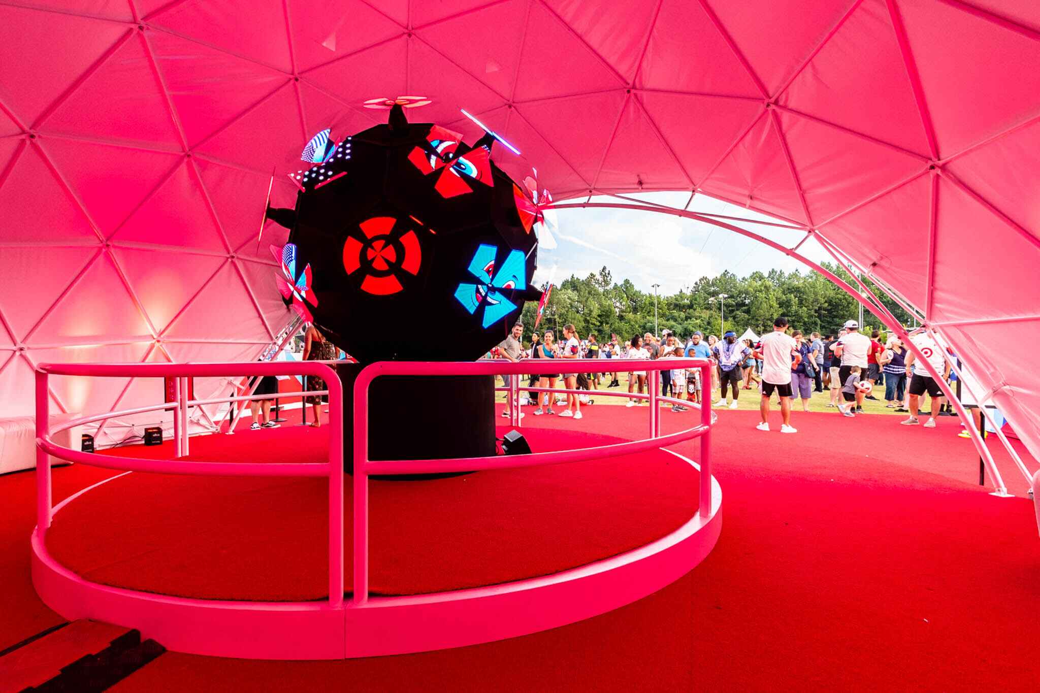 Geodesic dome tent with experiential marketing structure inside