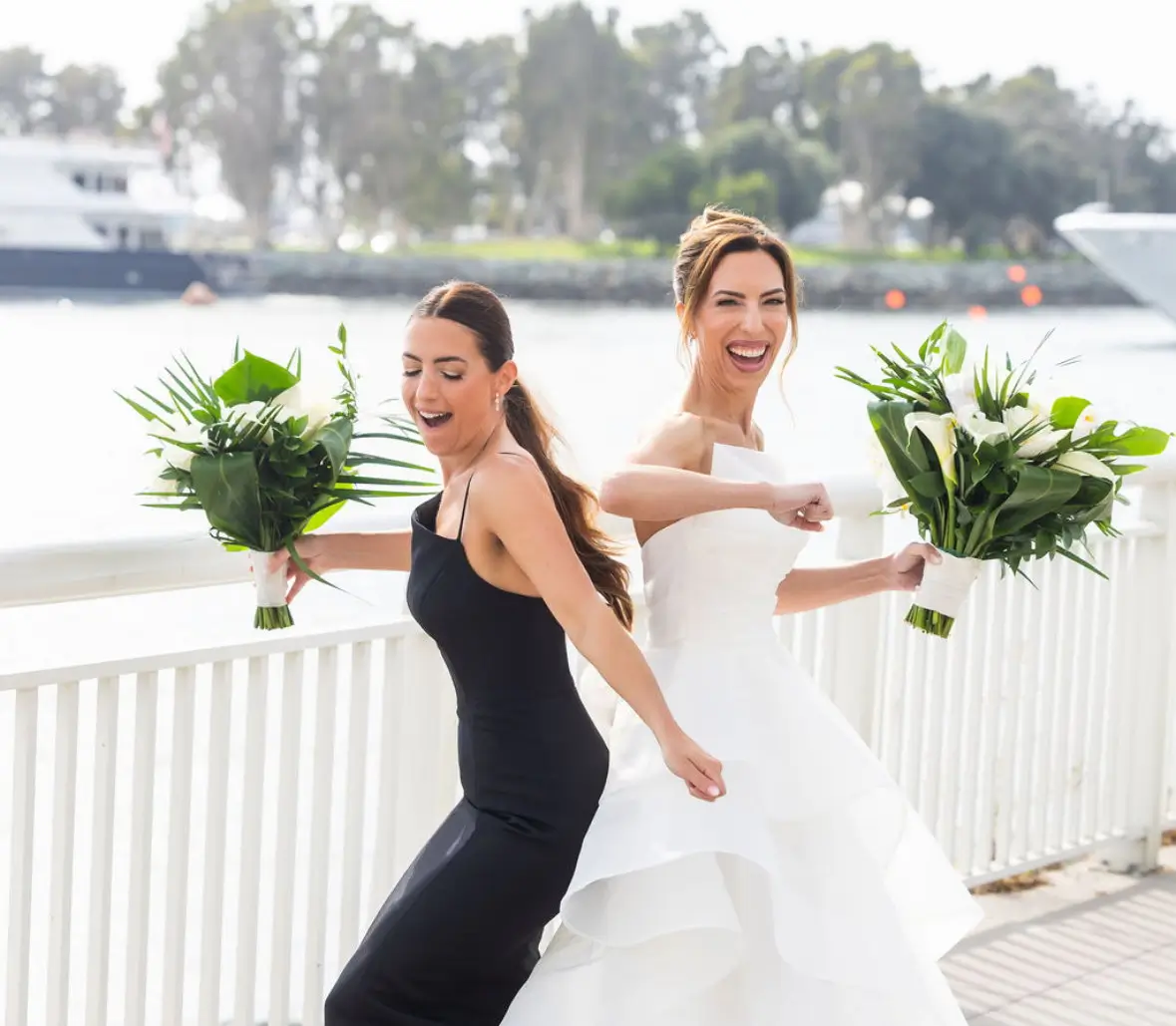 A photo of a bride and bridesmaid dancing