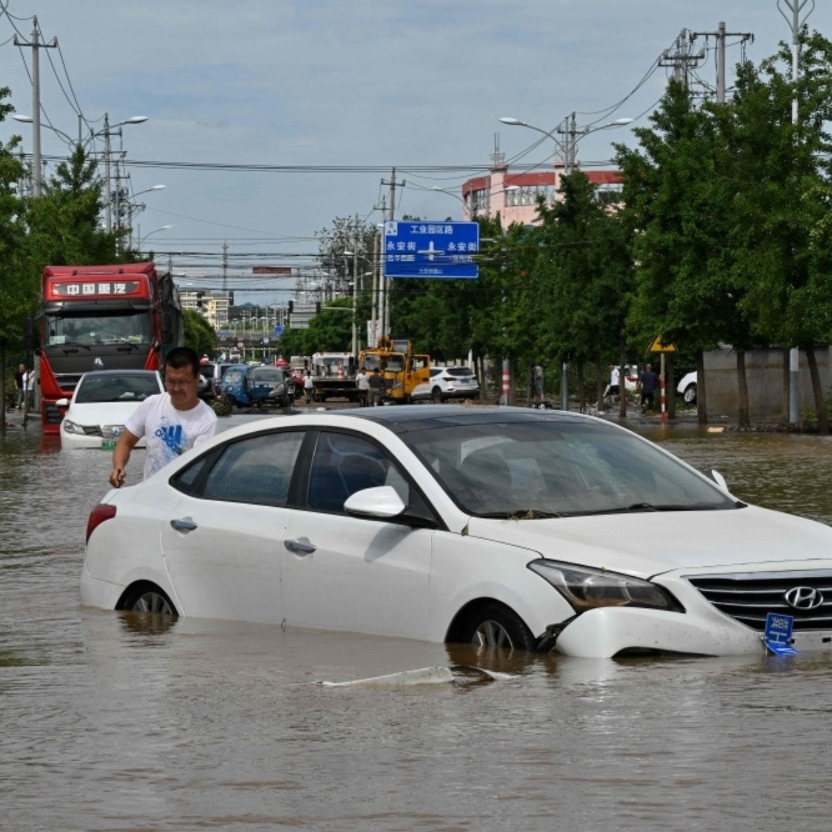 Over 30 killed and tens of thousands evacuated as torrential rains and landslides devastate northern China.