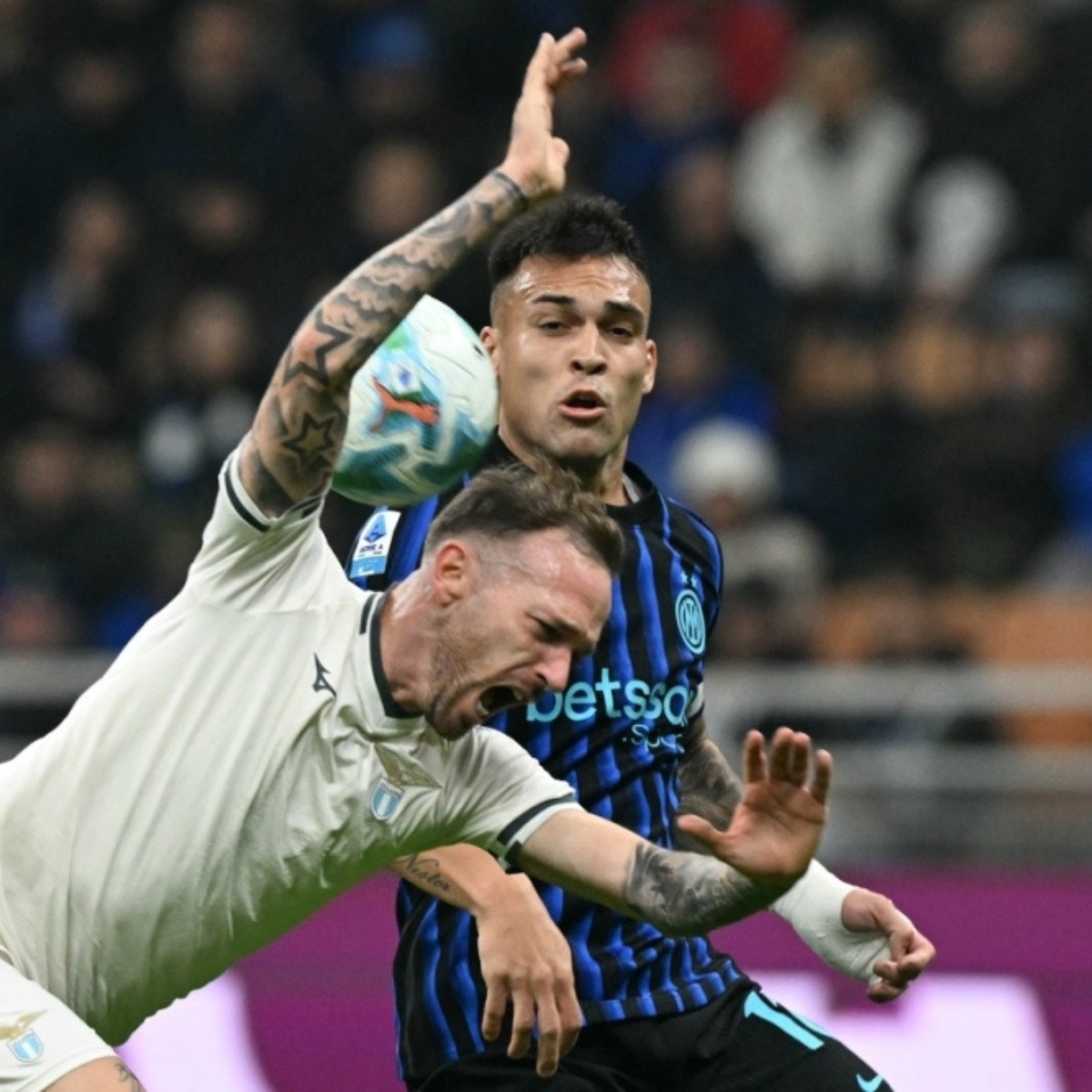 Inter take Serie A lead with victory over Lazio as defending champions Napoli slump at Bologna.