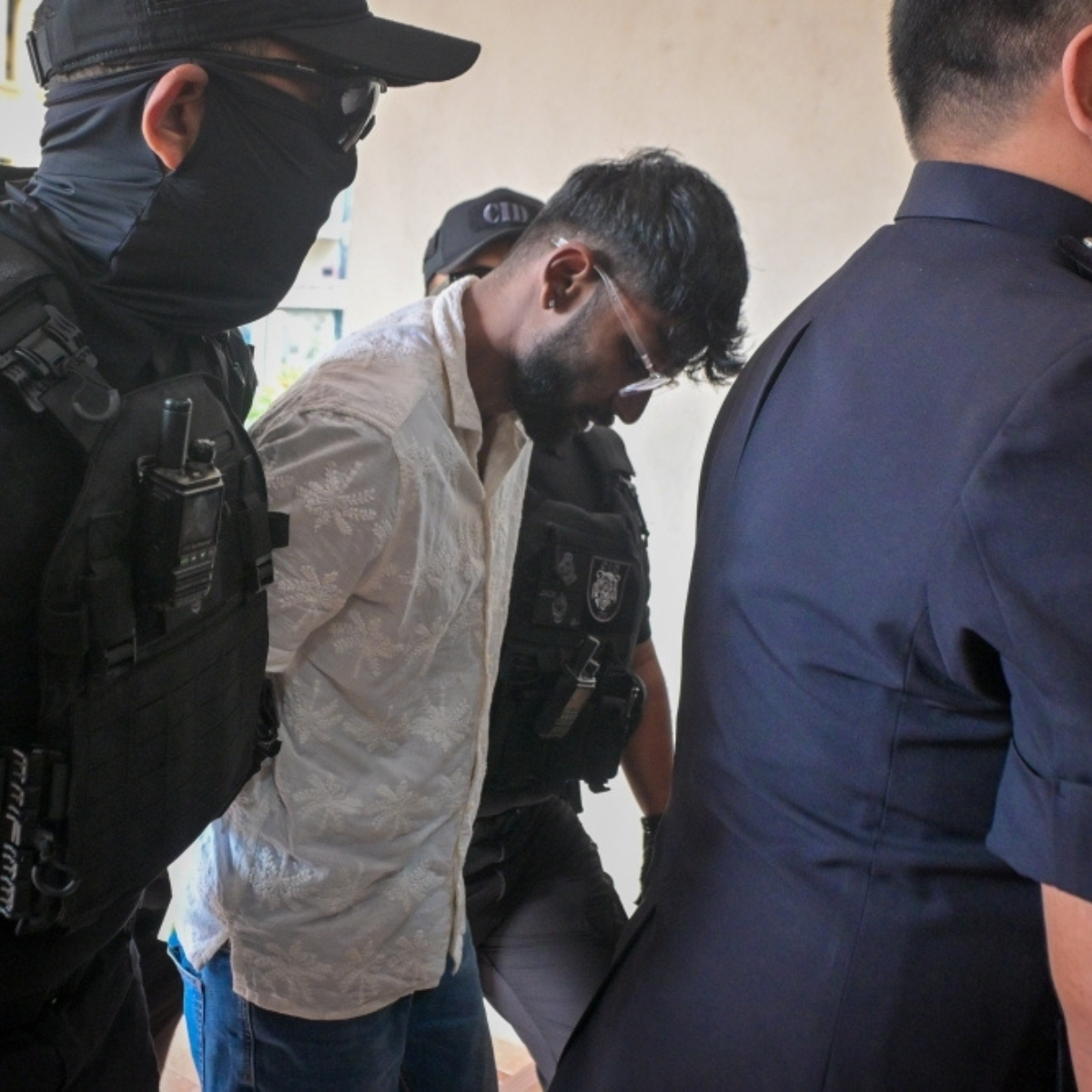 Two men charged with murdering saleswoman found bound and naked near the Seri Kembangan roundabout.