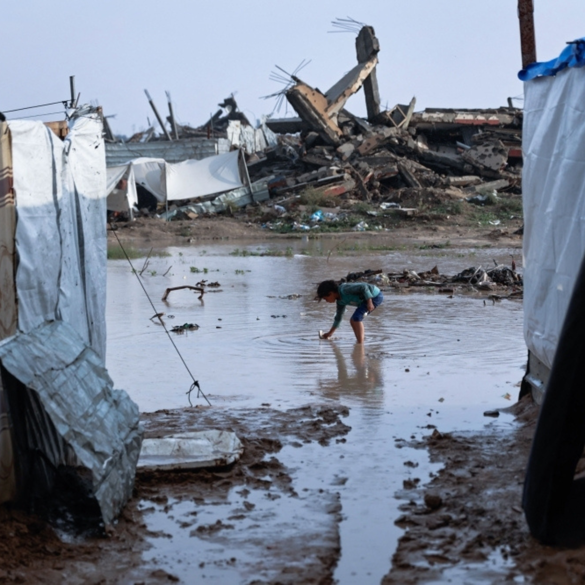 Gaza storm claims at least 13 lives, including three children who died from exposure in tents.