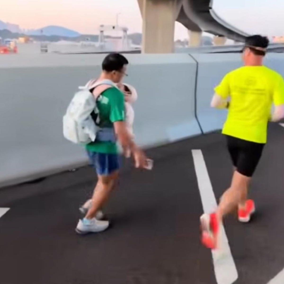Police investigate runner over stunt involving carrying a baby at Hong Kong Marathon