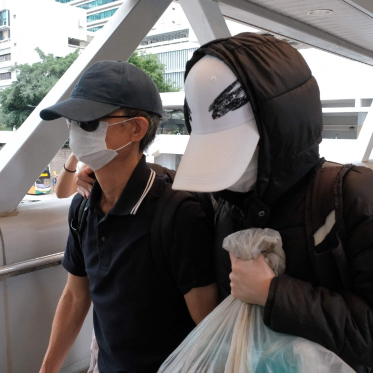 First conviction under Hong Kong’s new Article 23 law sees activist’s father sentenced to eight months’ jail for managing her insurance funds.