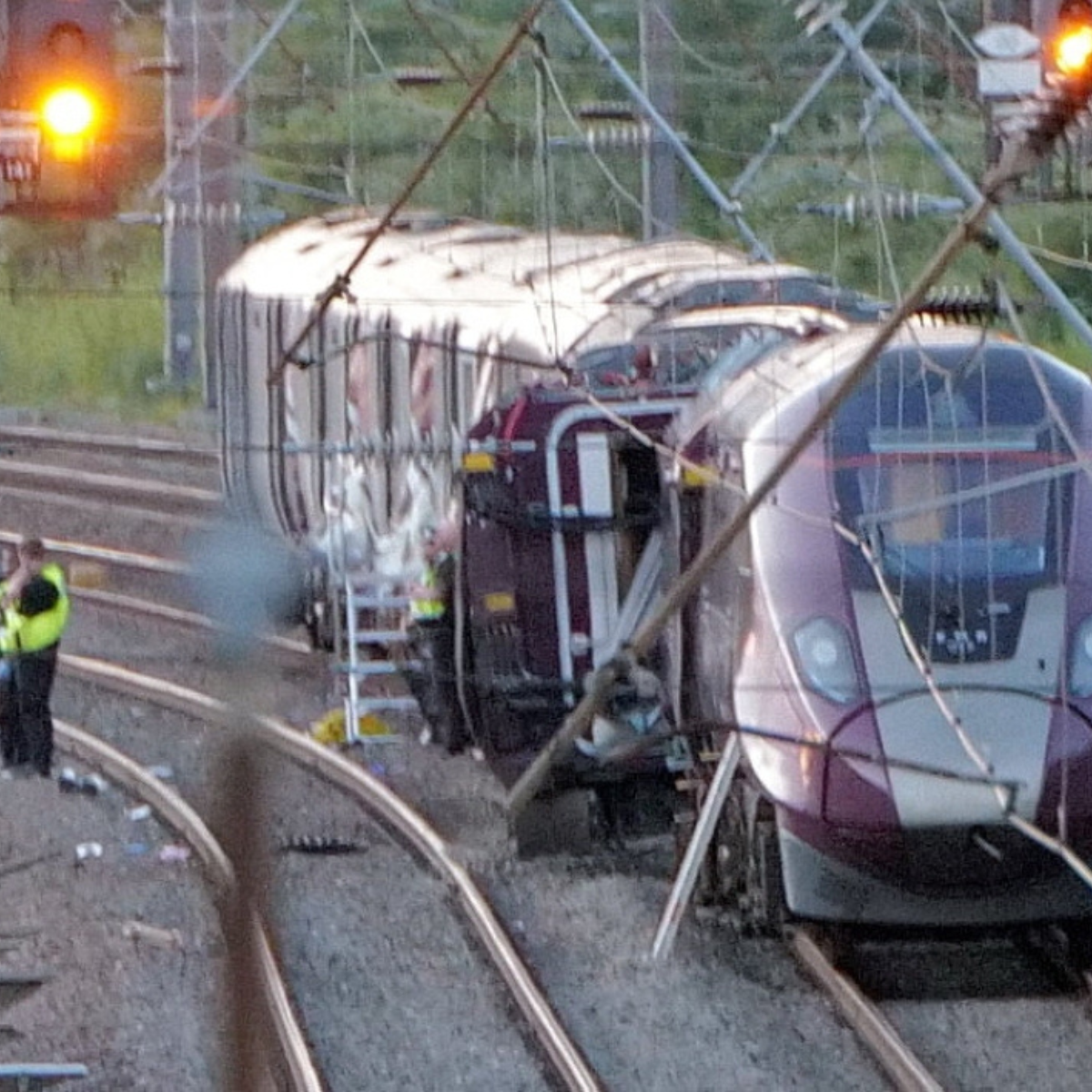 ‘Huge bang’ reported as two trains collide north of London, leaving one passenger dead