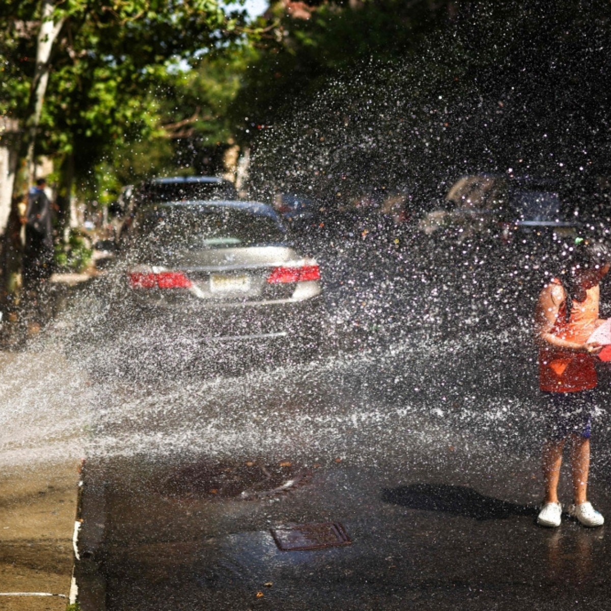 New Yorkers open fire hydrants to beat 43°C heatwave as extreme heat scorches city