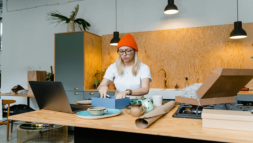 woman packing products for sale as one of the things to sell to make money
