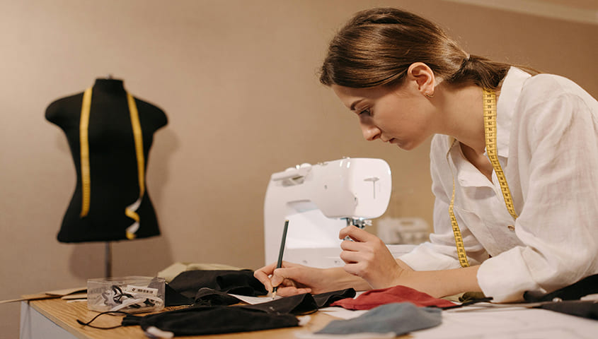 clothing designer creating apparel as one of the things to sell to make money