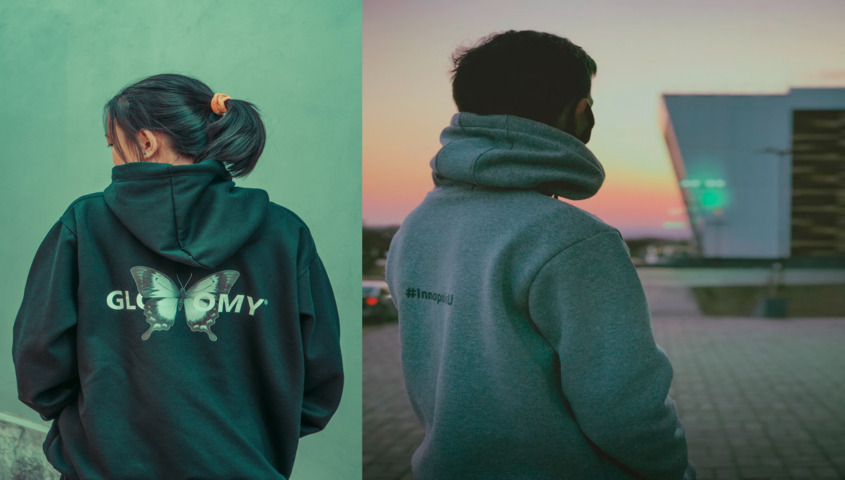 A man and a woman are wearing pod hoodies