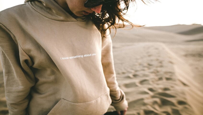 woman is wearing an eco-friendly hoodie made of friendly materials.