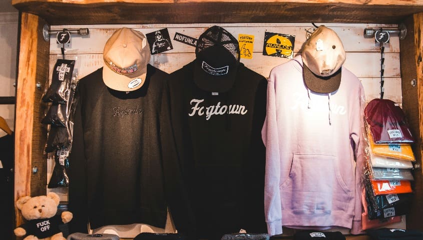 Three print-on-demand custom sweatshirts and hoodies