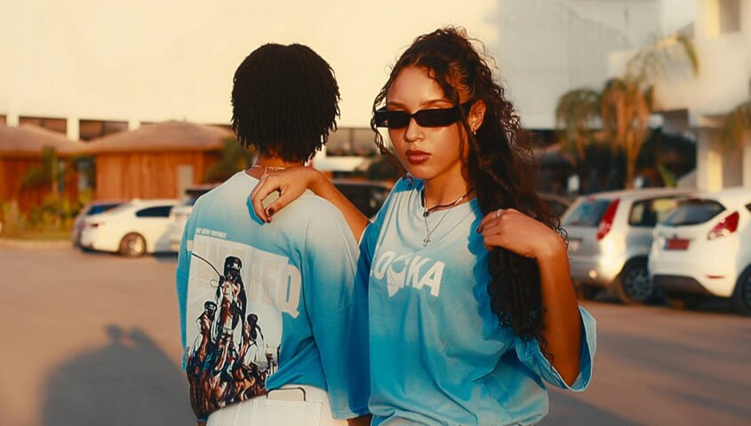 The models from the art-printed clothing store are showcasing the clothes.