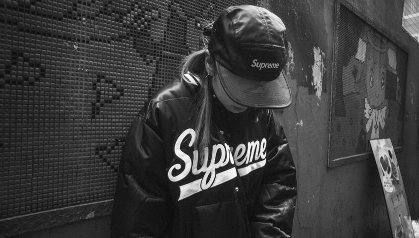 Supreme streetwear outfit showcasing a well-known clothing brand name
