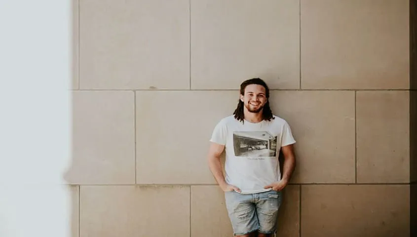 man shows custom t-shirt