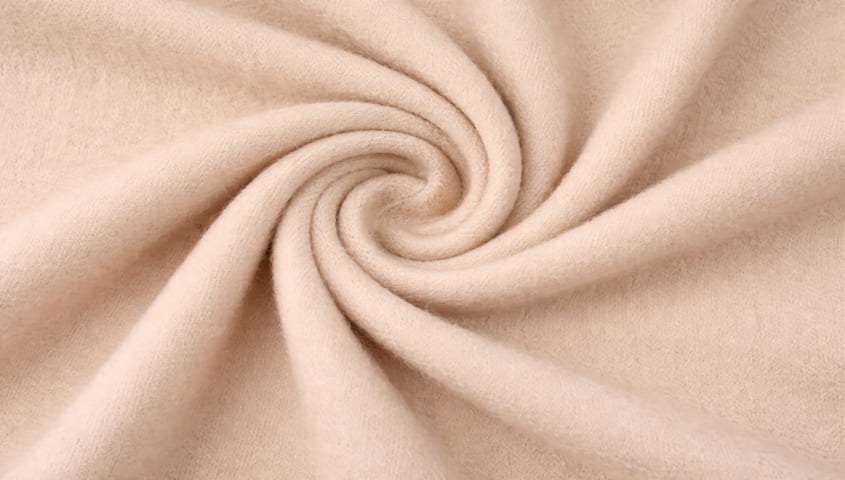Acrylic fabric texture showing a soft, wool-like type of fabric used in clothing.