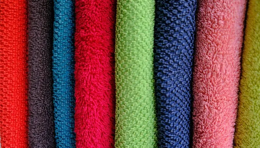 Fleece fabric texture showing a soft, insulating type of fabric commonly used in apparel.