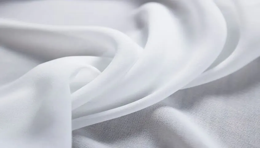 Chiffon fabric with a lightweight, sheer texture, showing one of the common types of fabric used in clothing.