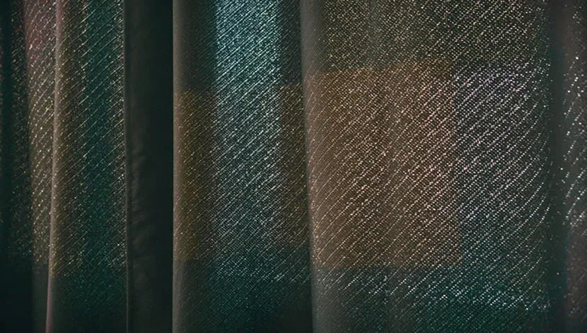 Canvas fabric with a heavy, durable weave, showing one of the common types of fabric used for sturdy garments and goods.