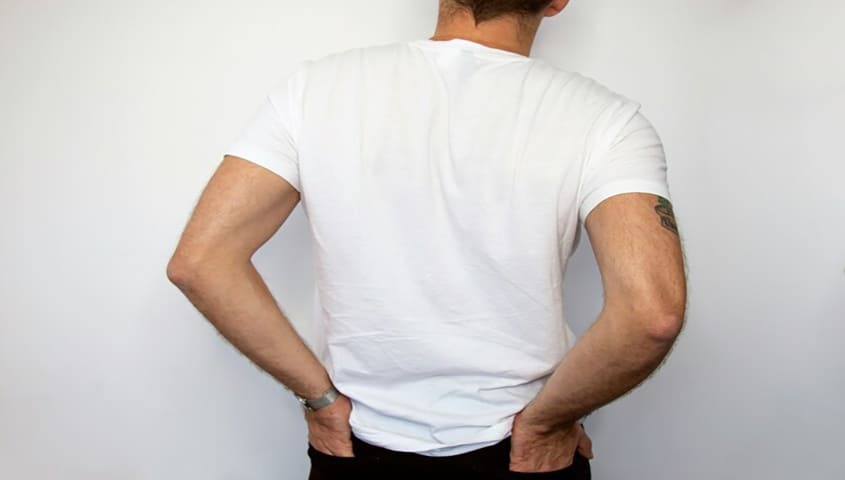 White cotton T-shirt showing fit and drape, a common type of fabric used for everyday T-shirts.