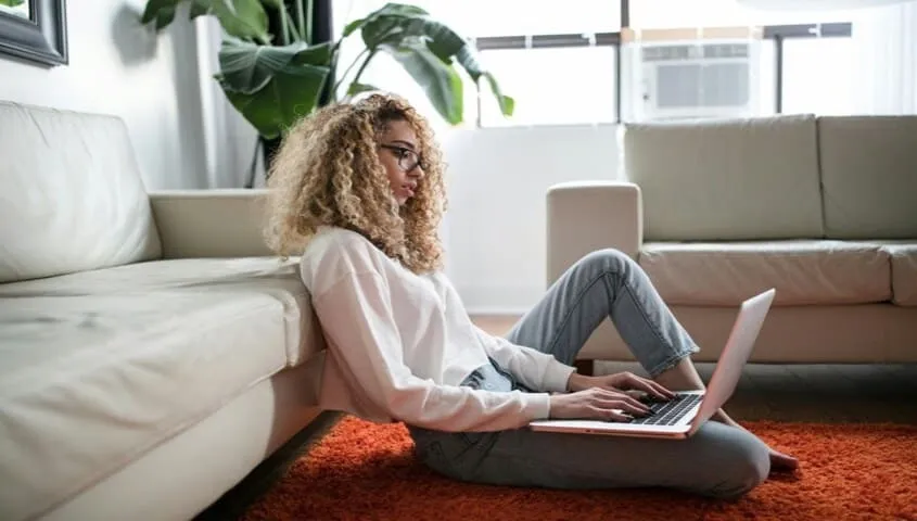 researching Etsy shop name ideas on a laptop at home