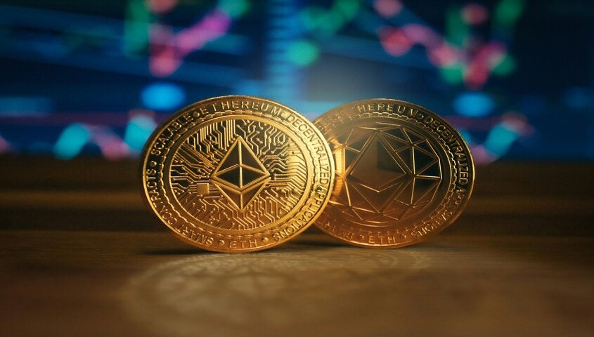 Ethereum coins on a desk, representing DeFi strategies used for how to make 100 dollars a day.
