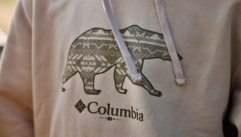 Example of what is sublimation printing on a polyester hoodie, where the design has no raised texture or ink layer.