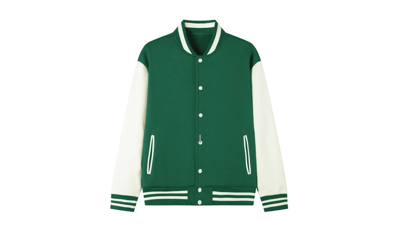 Green varsity jacket styled with wide-leg trousers representing iconic 90s outfits and 90s mens fashion.