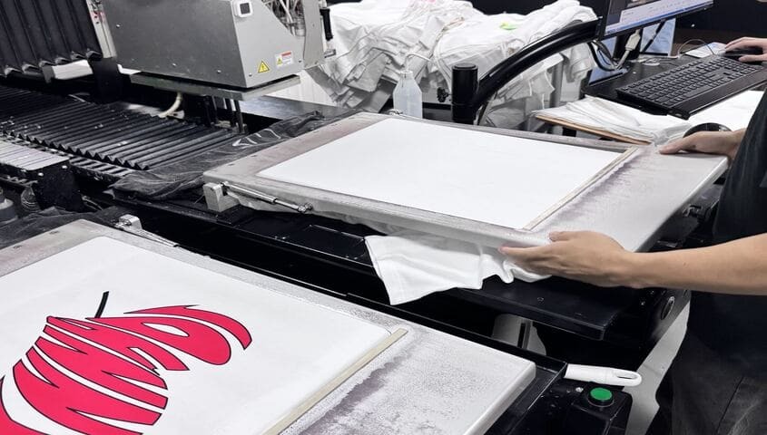 Tapstitch printing machine producing a custom T-shirt