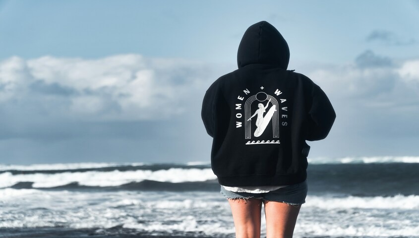 Oversized back print hoodie design on a black custom hoodie — bold graphic placement for clothing brands