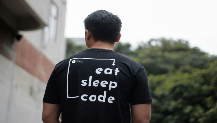 Man wearing a custom black graphic t-shirt, representing custom apparel as one of the best selling items on Etsy in 2026.